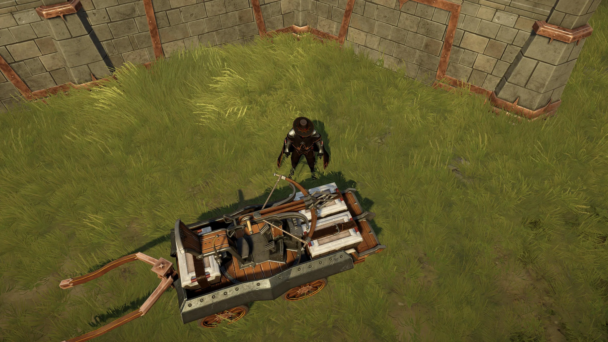 War Wagon in a grassy development scene beside a character and stone fortification walls, viewed from above